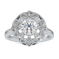 Art deco engagement ring with intricate artisan design and round diamond
