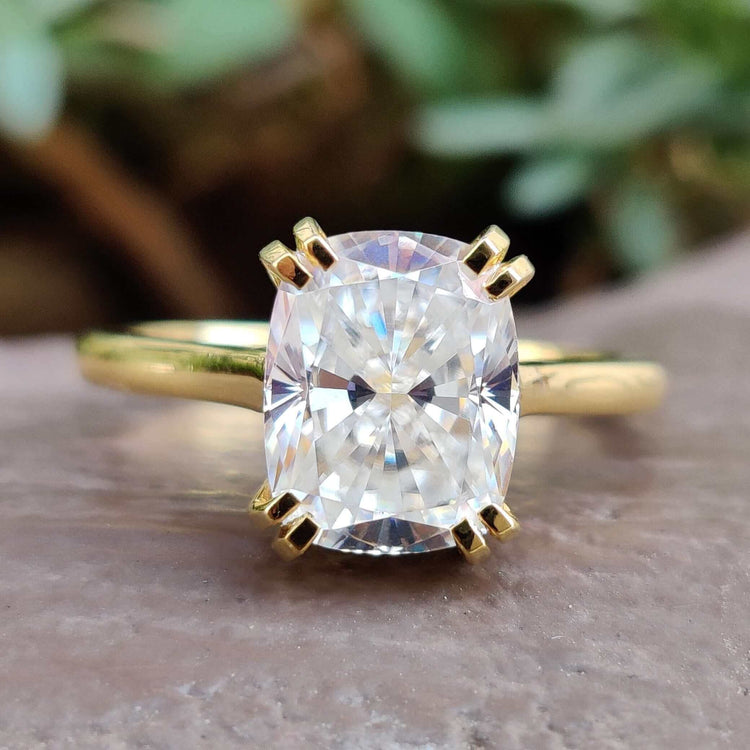 Elongated cushion cut ring with intricate detailing.