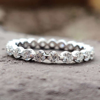 Elegant moissanite wedding band with brilliant gemstones set in a timeless design.