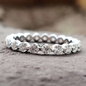 Elegant moissanite wedding band with brilliant gemstones set in a timeless design.