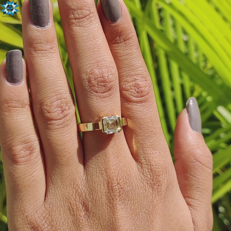 A delicate asscher cut ring with intricate details, ideal for timeless elegance.
