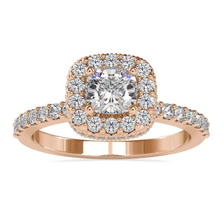 Cushion cut halo engagement ring featuring a Lab Grown Diamond and a four prong setting.