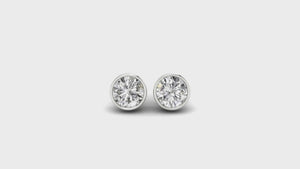 Delicate white gold ear studs with diamond accents ideal for everyday wear.
