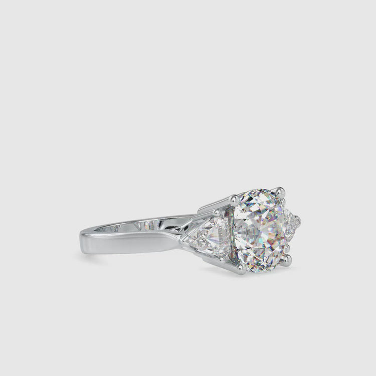 Cushion cut diamond ring with prong setting in white gold band
