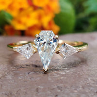 This three stone ring symbolizes the past, present, and future of your love.
