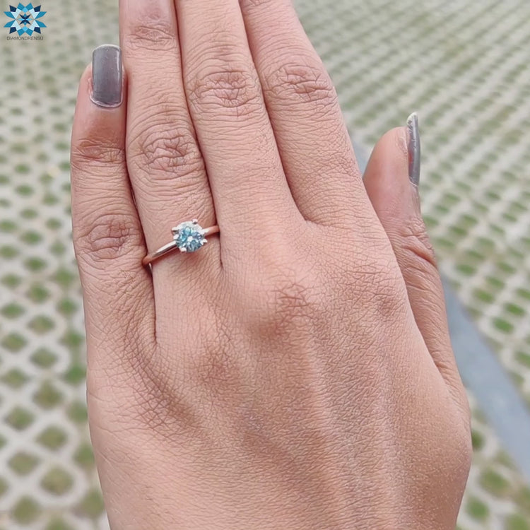 Sparkling round moissanite engagement ring for a timeless proposal.
