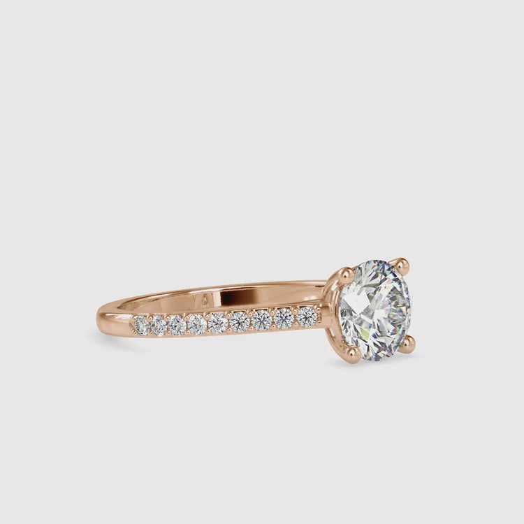 Classic cathedral ring with a prong setting and a round diamond centerpiece.