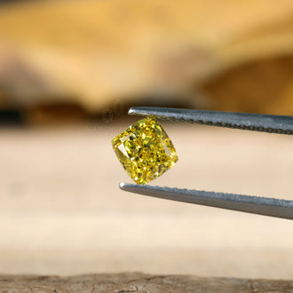 Yellow diamond 1 carat cushion diamond.
