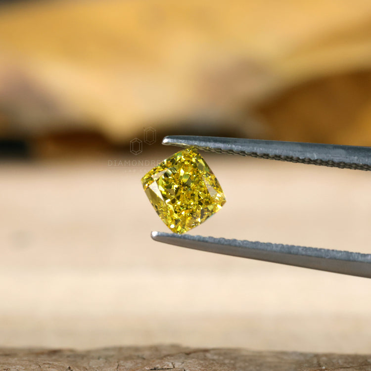 Yellow diamond 1 carat cushion diamond.
