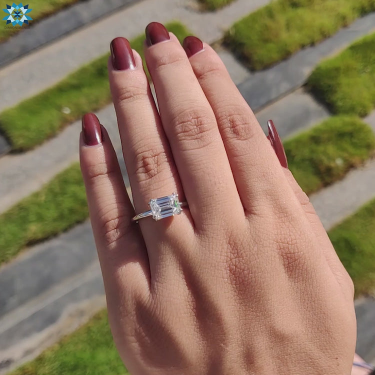 Moissanite engagement ring showcasing a stunning solitaire emerald cut.
