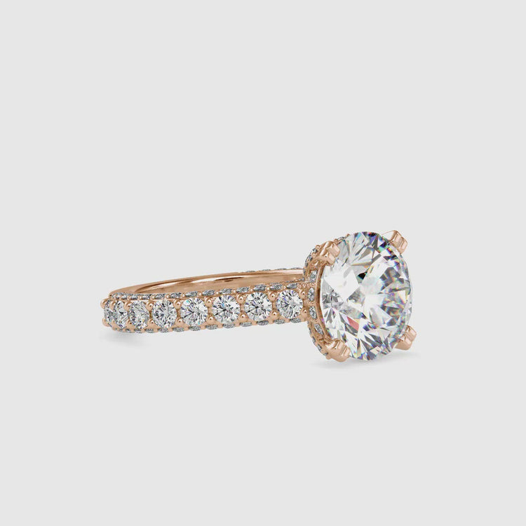 Round diamond engagement ring in a cathedral style setting.
