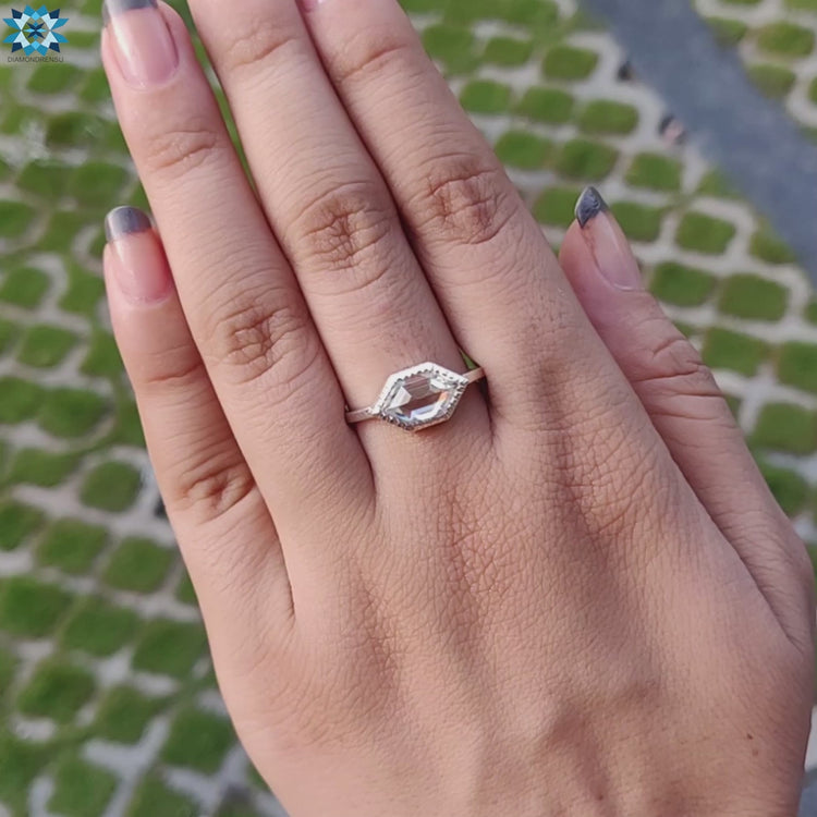 Elegant hexagon cut engagement ring featuring a classic design.

