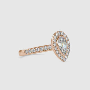 Pear shaped ring featuring a teardrop diamond with a bridge setting.
