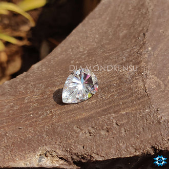 Loose moissanite stone with pear shape and colorless clarity for custom designs.
