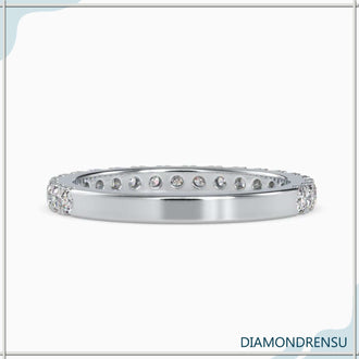 Handmade jewelry band with a round brilliant cut diamond and Lab Grown Diamond accents.
