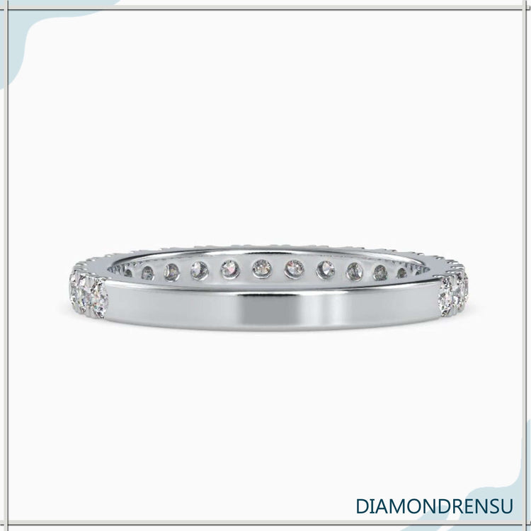 Handmade jewelry band with a round brilliant cut diamond and Lab Grown Diamond accents.
