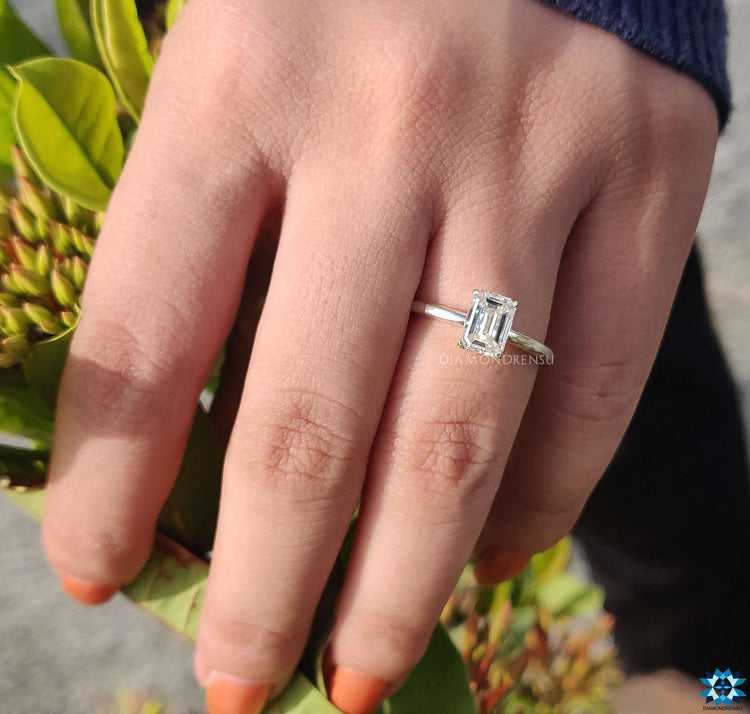 Classic emerald cut solitaire ring for a sophisticated look.