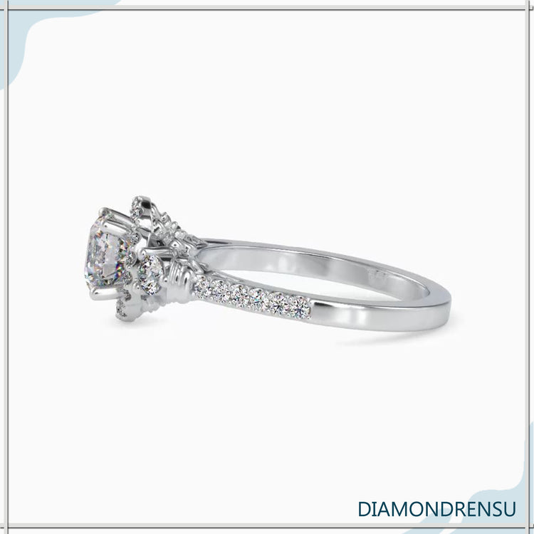 Halo diamond engagement ring with a four prong floral setting.