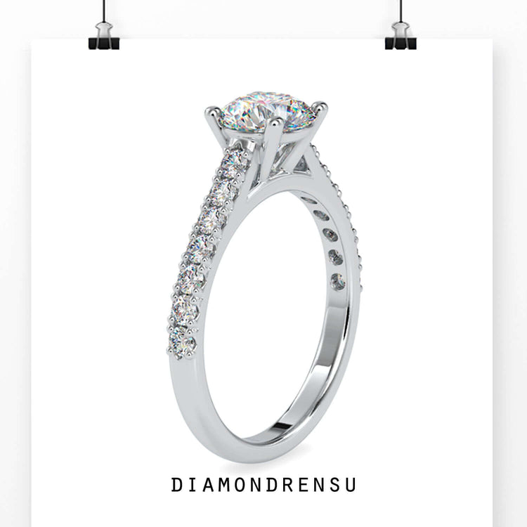 Handmade ring with a cathedral setting and pave diamond accents, perfect for an engagement.
