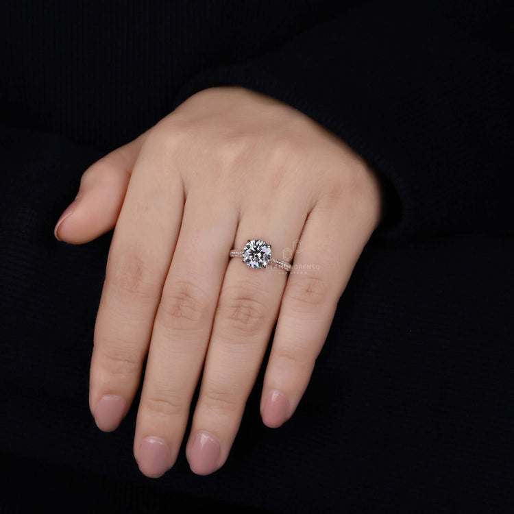 Custom diamond ring with 4 prong claw setting.
