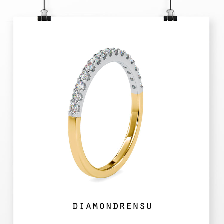 Lab grown diamond wedding band with brilliant cut diamonds in a gold setting.
