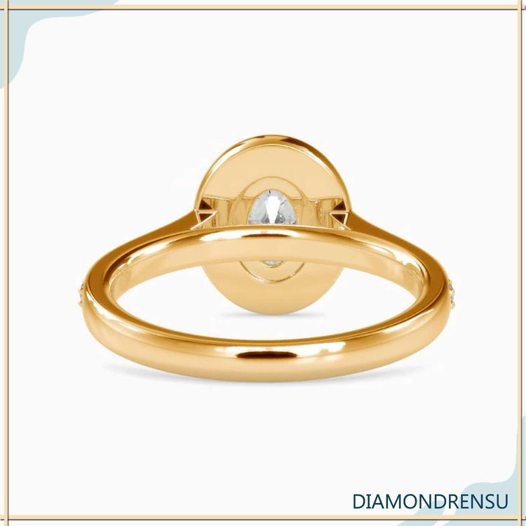 Diamondrensu ring with 2 carat oval diamond in halo and pave setting