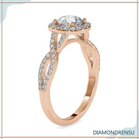 Pave twist ring in a round cut halo engagement design.
