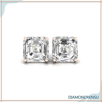 Simple gold earrings featuring asscher cut diamonds, perfect for understated elegance.
