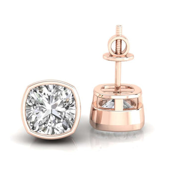 Elegant cushion cut diamond earrings in a bezel setting, perfect for formal occasions.
