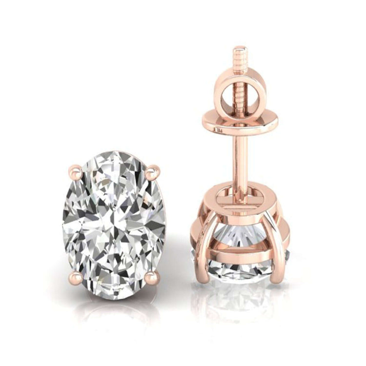 Elegant oval diamond earrings in a tapered basket post earring setting for a refined look.
