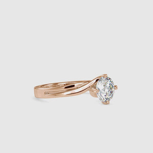 Twisted engagement ring featuring a stunning round cut diamond.
