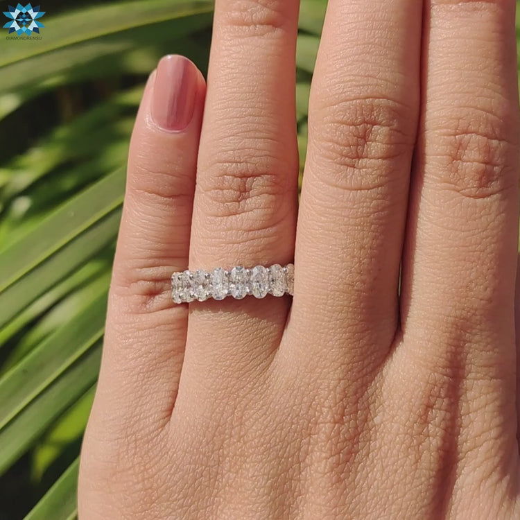 Gorgeous moissanite band with sparkling diamonds, designed in a classic band moissanite style.
