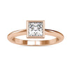 Elegant bezel set engagement ring featuring a princess cut diamond.
