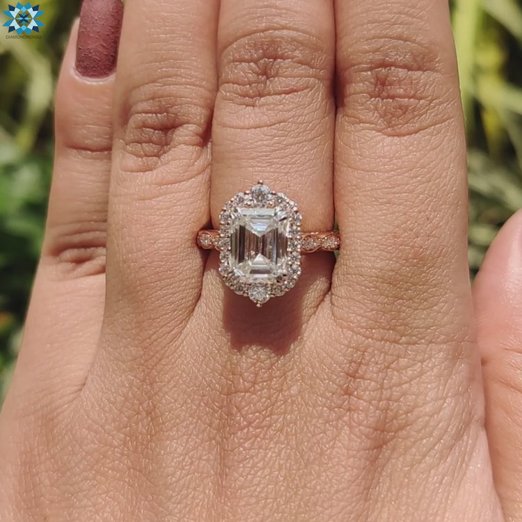 Elegant emerald cut ring with intricate details, showcasing a flawless and sophisticated design for engagement.
