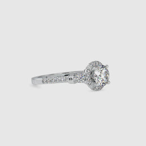 Flower diamond engagement ring with a gold floral ring setting.
