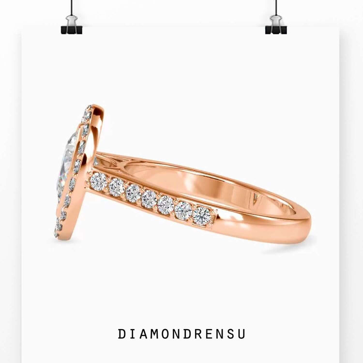 Pear diamond engagement ring in a classic cathedral setting.
