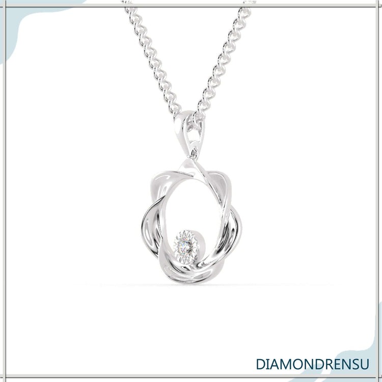 The floating diamond pendant shines with suspended elegance.
