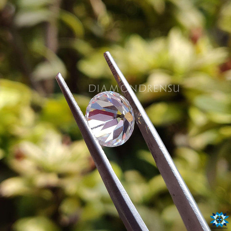 Old European cut moissanite stone with round shape and vintage antique design elements.
