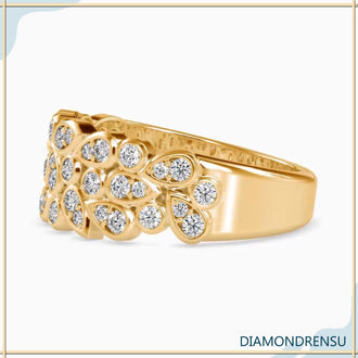 Pear bezel ring with a round brilliant cut diamond for a designer wedding band style.
