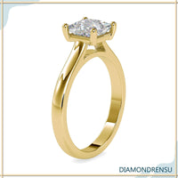 Princess diamond cut ring with a gold solitaire engagement ring setting for timeless elegance.
