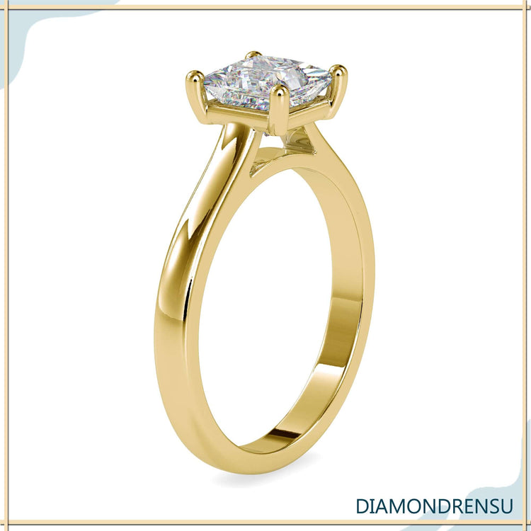 Princess diamond cut ring with a gold solitaire engagement ring setting for timeless elegance.
