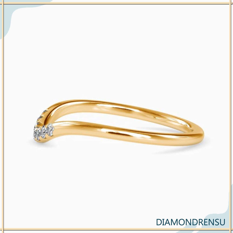 Handmade band with lab grown diamonds, rose gold, and a sleek curve
