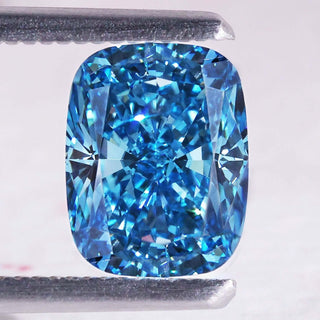 Blue cushion cut diamond shown as a 2.5 carat IGI certified lab grown stone.
