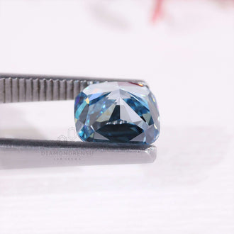 Lab grown diamond in cushion cut with rare blue color and 2.7 carat weight.
