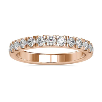 Diamond wedding band with round cut diamonds in a white gold setting.
