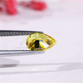Loose pear shaped diamond yellow lab grown.