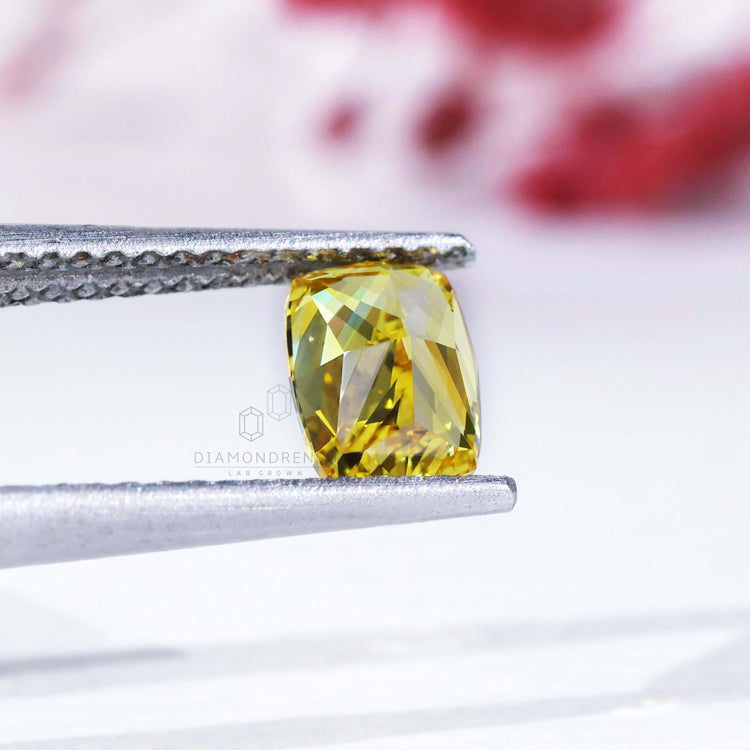 Elongated cushion cut loose diamond yellow lab grown.
