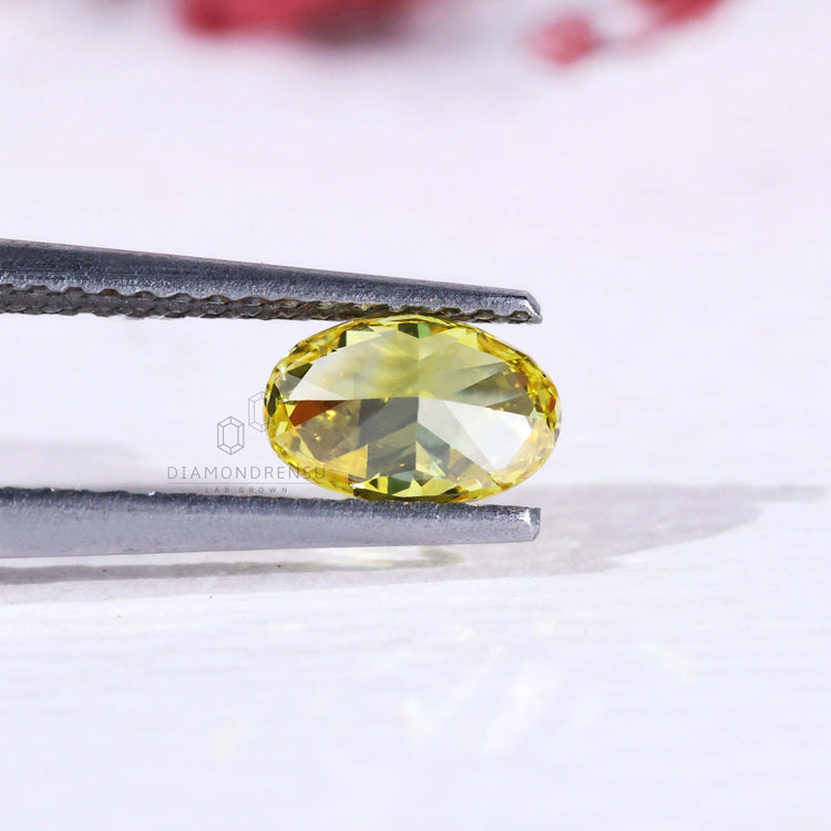 Buy loose lab grown oval yellow diamond 0.60 carat.
