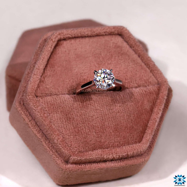 4 prong solitaire engagement ring offering secure setting and timeless beauty.
