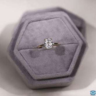 Oval moissanite ring set in classic yellow gold
